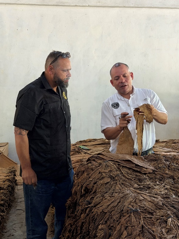 Juan Gómez López sharing tobacco knowledge at the factory